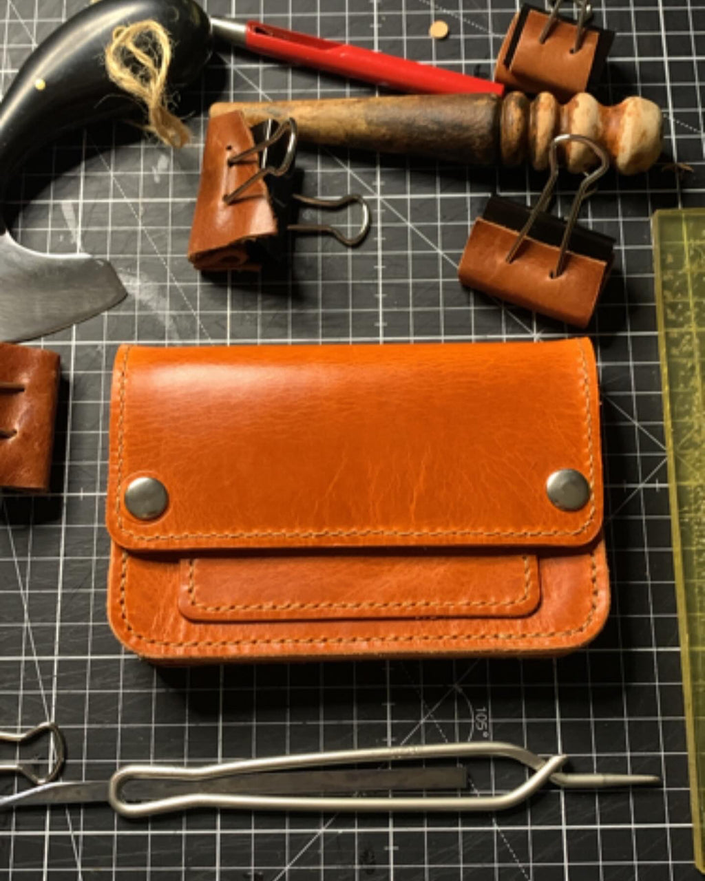 Mid size trucker wallet made using orange Gaucho Leather