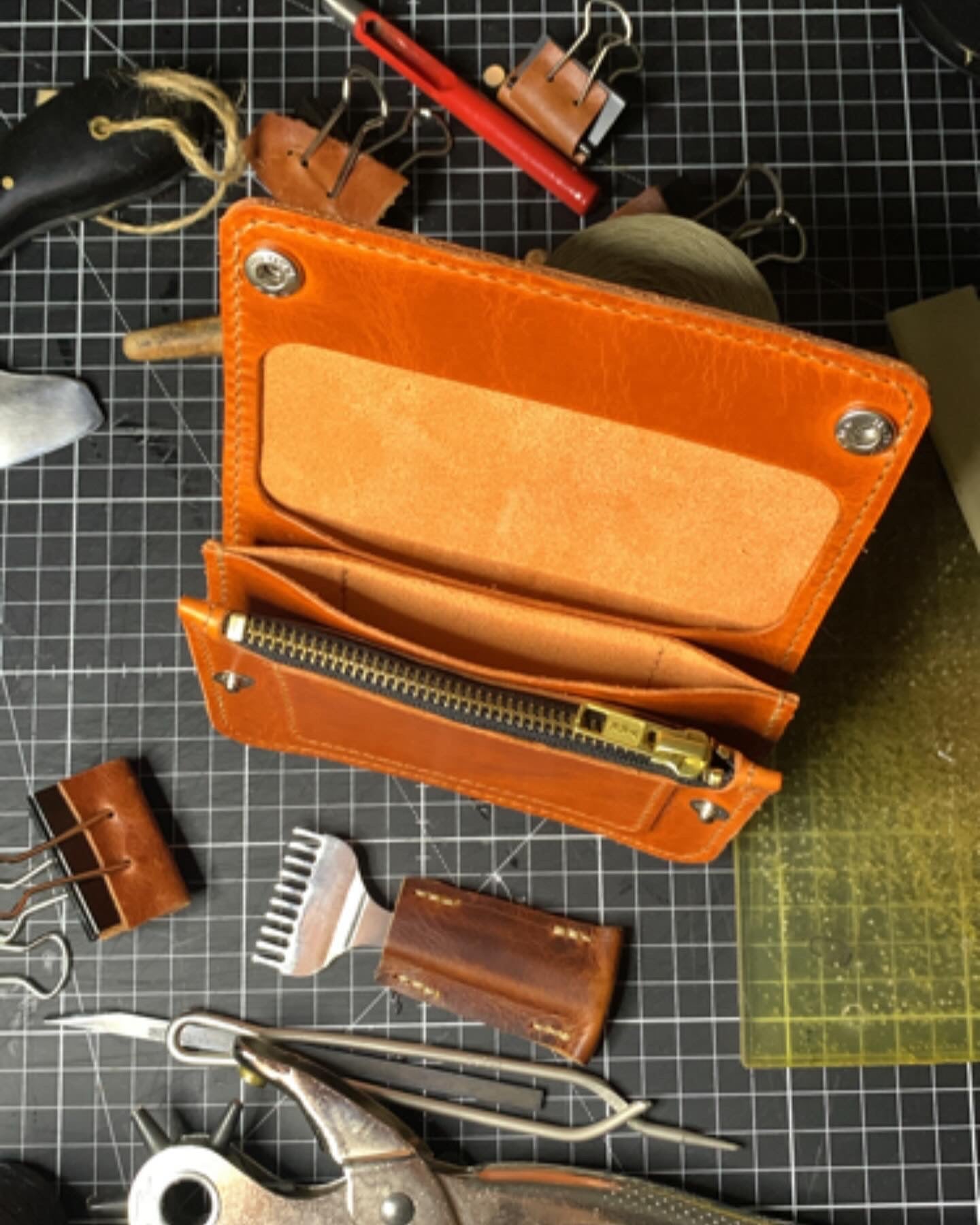 Mid size trucker wallet made using orange Gaucho Leather