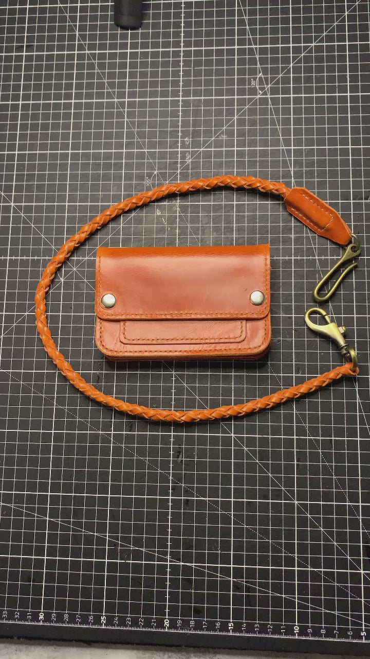 Mid size trucker wallet made using orange Gaucho Leather